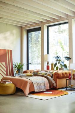 DFS Belair three-seater sofa bed in orange sensual velvet, available exclusively at DFS