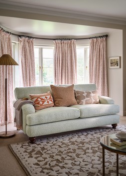 Hampton 2 Seater Sofa in Hampton Chunky Knit Chenille Natural/Burnt Sienna Mix with Walnut Feet, £1699. Hampton Accent Chair in Hampton Chunky Knit Chenille Natural/Burnt Sienna Mix with Walnut Feet, £799.